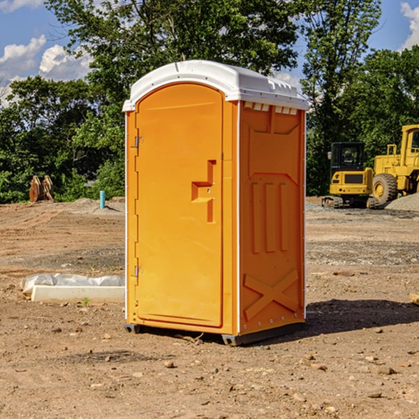 what is the cost difference between standard and deluxe portable restroom rentals in Dustin